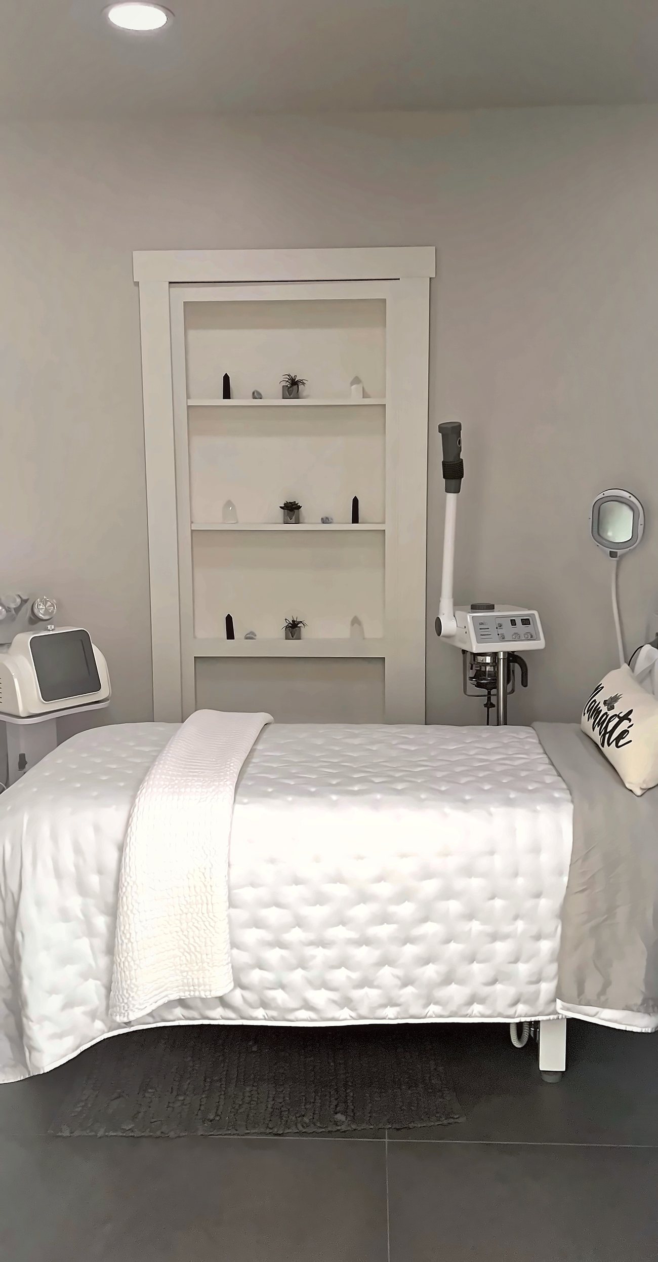 The treatment room at Skin Restore, San Clemente — treatment bed, magnifying lamp and equipment